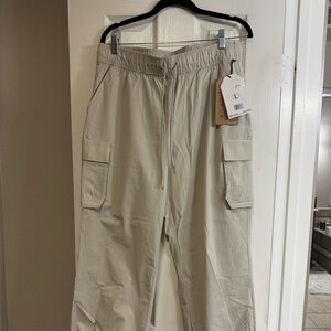 Avalanche Outdoor Supply Co. beige cargo pants. Elastic drawstring waist.